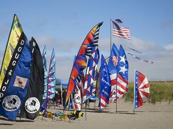 WA, Long Beach, International Kite Festival, Colorful banners and flag