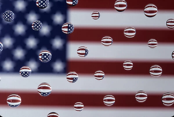 WA, Redmond, American flag; reflected in water drops