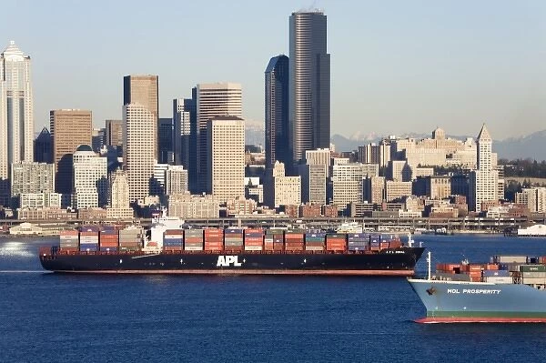 WA, Seattle, Seattle skyline and Elliott Bay with container ship, view from Hamilton Park