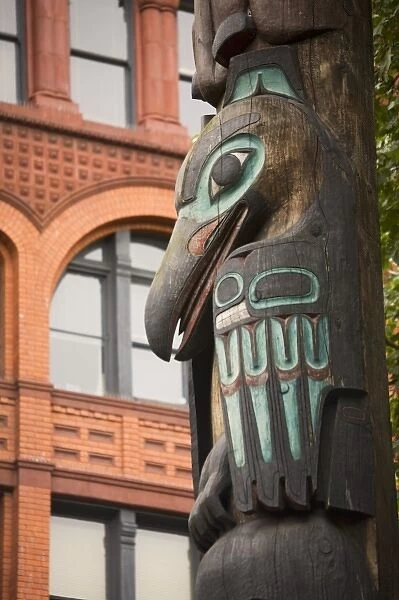WA, Seattle, Totem pole and Pioneer building at historic Pioneer Square