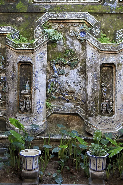 The wall of an inside courtyard in Quan Thang House in Hoi An, Vietnam