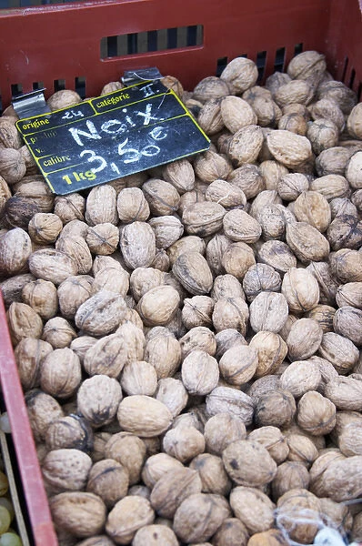 Walnuts for sale at a market stall at the market in Bergerac for 3. 50 euro per kilo