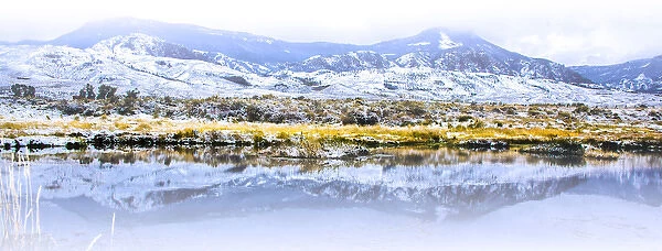 Wapiti Valley, Wyoming. Reflection of montains in a pond