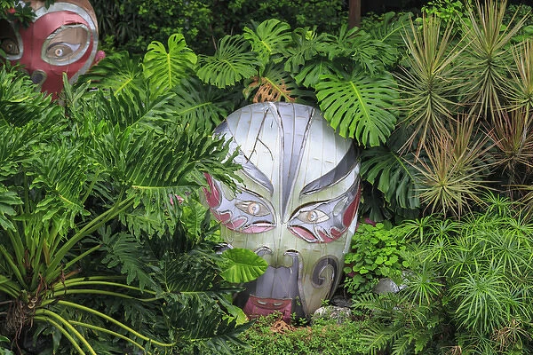 warrior masks in lush green tropical foliage, Lichi Bay Walkway and Park, Guangzhou