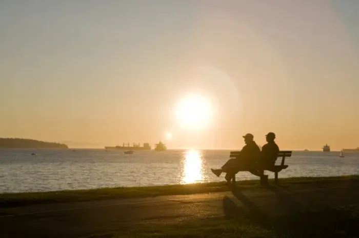 Framed Print : Watching the sunset at English Bay Beach in the West End of Vancouver, BC, Canada