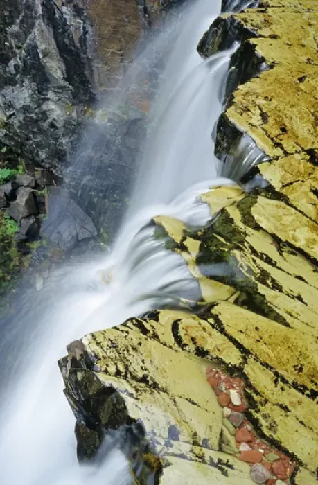 Framed Print : Water cascades over Rockwell Falls in Glacier National Park in Montana