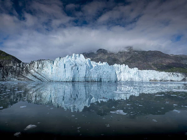 The waters of Tarr Inlet create a perfect reflection for the terminus of Margerie Glacier