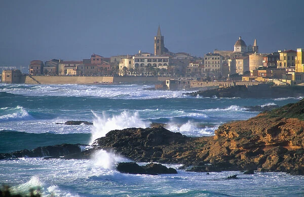 Waves crash on the coast at Alghero, Sardinia, Italy. roman, ancient, historical