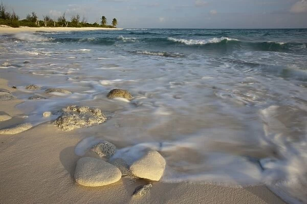 Waves crashing on crushed coral and coral fossils on the beaches of Punta Arena, Mona Island