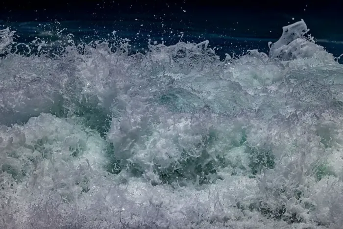 Framed Print : Waves foaming and bubbling when they hammer the sandy beach at Sunset Beach