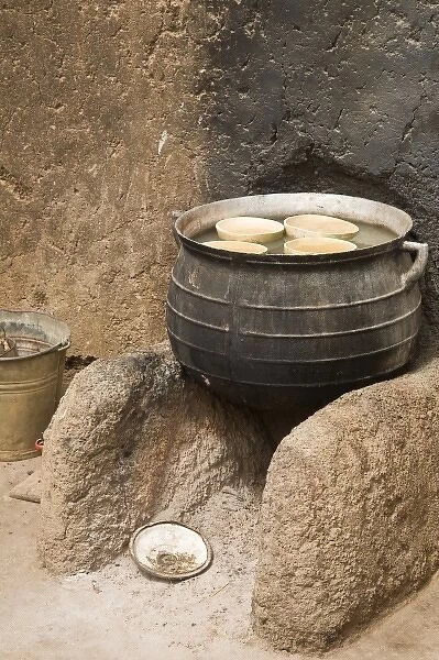 West Africa, Africa, Ghana, Nakpa. Pot on stove against wall of traditional mud dwelling