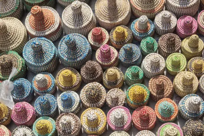 Framed Print : West Africa, The Gambia, Banjul. A collection of colorful woven baskets viewed from above
