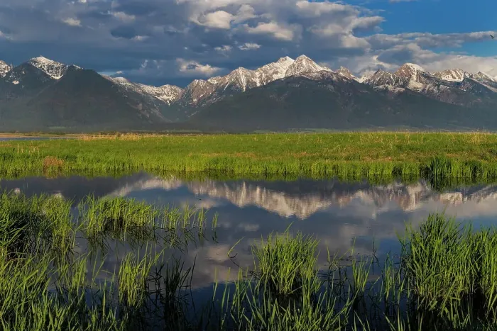 Framed Print : Wetlands pond reflects the Mission Mountains at sunset at Ninepipe National Wildlife Refuge near Ronan, Montana, USA Framed Print : Wetlands pond reflects the Mission Mountains at sunset at Ninepipe National Wildlife Refuge near Ronan, Montana, USA