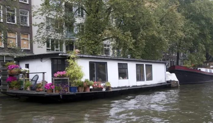 Framed Print : A white houseboat with lots of pink flowers surrounded by trees Framed Print : A white houseboat with lots of pink flowers surrounded by trees