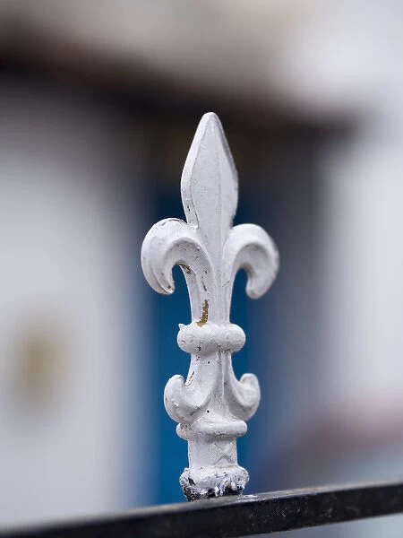 A white metal spike sticks up from a gate in Bangalore, Karnataka, India