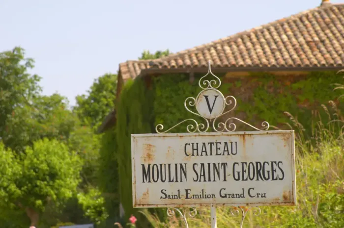 Framed Print : A white sign saying Chateau Moulin Saint Georges Saint Emilion Grand Cru Saint Emilion