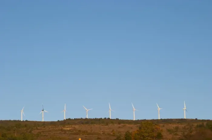 Framed Print : Wind power turbines on a mountain hill top crest against a blue sky. Limoux. Languedoc Framed Print : Wind power turbines on a mountain hill top crest against a blue sky. Limoux. Languedoc