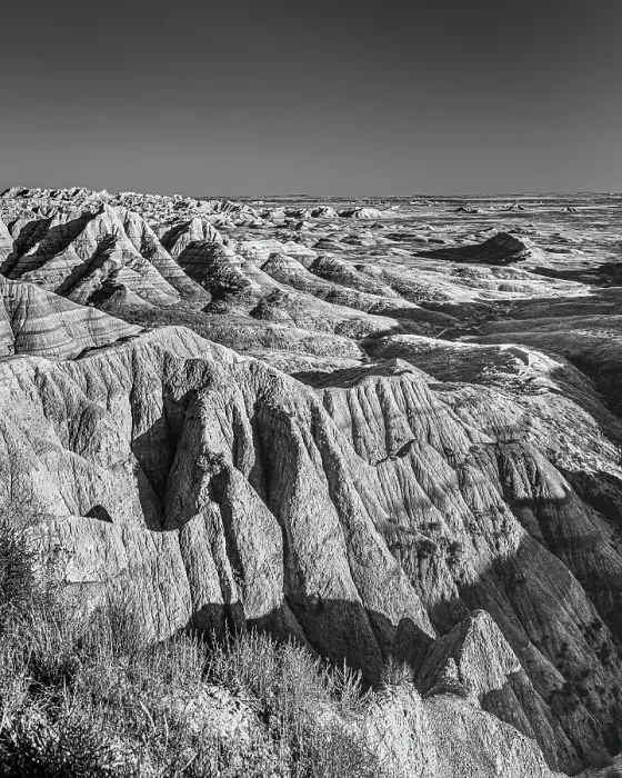 Framed Print : The wind and water eroded landscape in the Badlands National Park seem desolate but make for beautiful natural carvings. USA Framed Print : The wind and water eroded landscape in the Badlands National Park seem desolate but make for beautiful natural carvings. USA