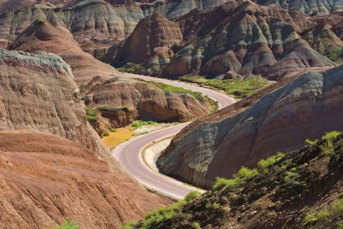 Framed Print : A winding road through the colorful mountains in Zhangye National Geopark