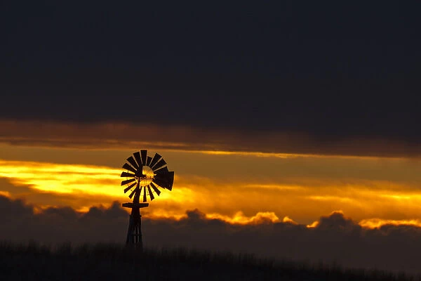 Windmill slihouetted against the sunset in the sandhills region of Loup County, Nebraksa