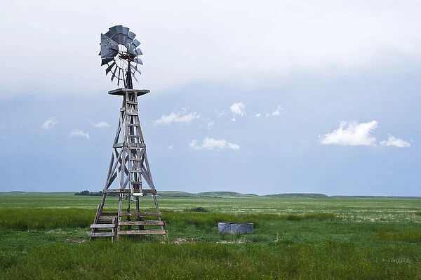 Windmill and storm clouds on Pawnee National Grasslands, eastern Colorado, USA, June