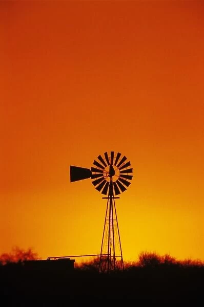 Windmill at sunset, Sinton, Texas, USA