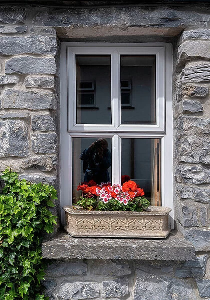 Window brings a smile to passersby in the historic village of Cong, County Mayo, Ireland