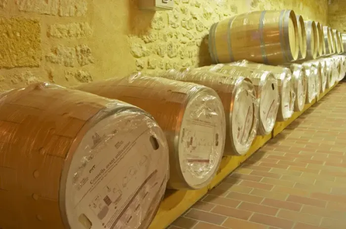 Framed Print : in the wine cellar: new Barriques barrels in their original packaging - Chateau Grand Mayne