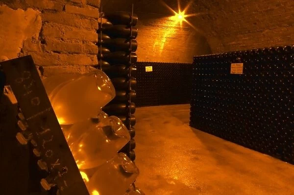 Wine cellar that is an old chalk quarry. A rack (pupitre) with bottles for the prestige