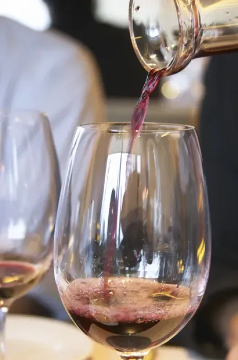 Framed Print : Wine being served in a glass from a decanter. The Restaurant Red at the Hotel Madero Framed Print : Wine being served in a glass from a decanter. The Restaurant Red at the Hotel Madero