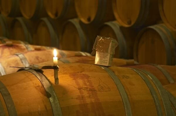The winery, barrel aging cellar: a burning candle, a box of sulphur pellets - Chateau