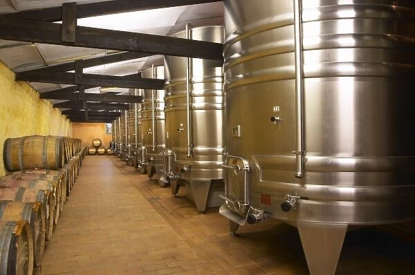 The winery with stainless steel fermentation tanks and old wooden barrels barriques Chateau Kirwan