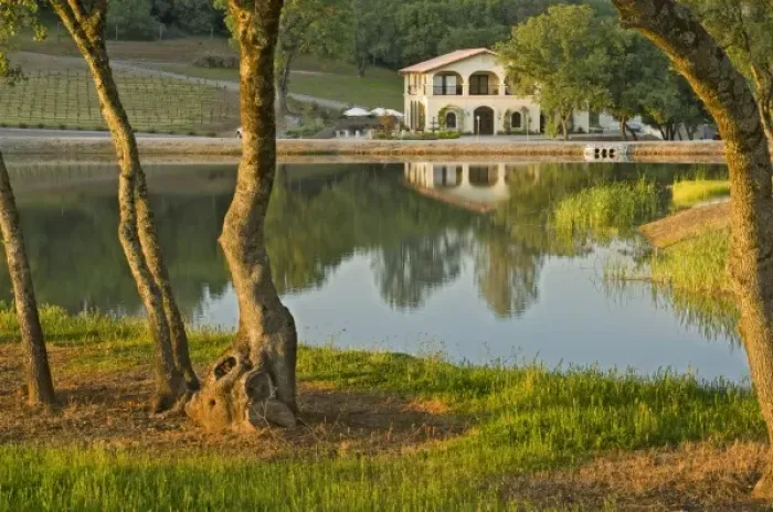 Framed Print : Winery and vineyard reflected in pond at David Girard Vineyards winery. North America
