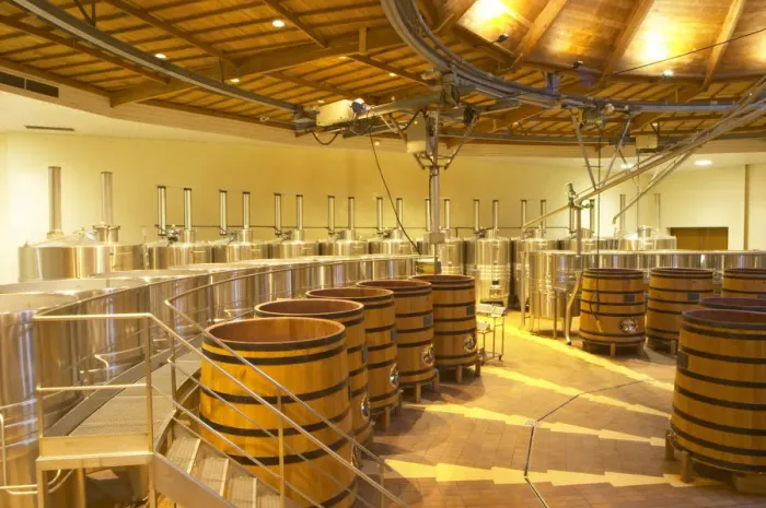Framed Print : The winery with wooden and stainless steel fermentation vats. It is built in a circular design