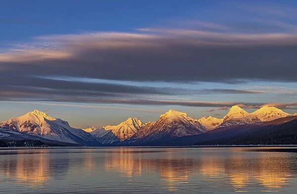 Winter sunset on mountain peaks over Lake McDonald in Glacier National Park, Montana, USA