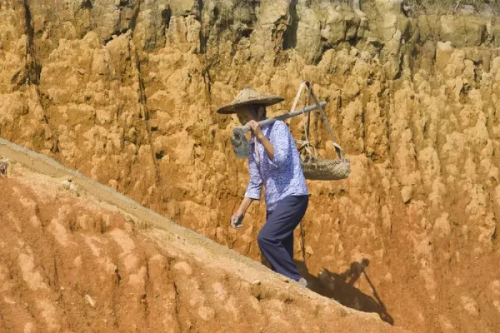 Framed Print : Woman carrying basket on clay hill, Yongding, Fujian, China (MR) Framed Print : Woman carrying basket on clay hill, Yongding, Fujian, China (MR)