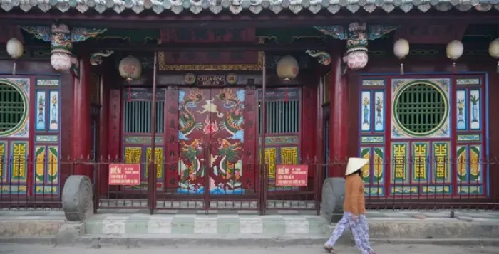 Framed Print : Woman with conical hat outside Chinese temple in Hoi An Ancient Town, UNESCO World Framed Print : Woman with conical hat outside Chinese temple in Hoi An Ancient Town, UNESCO World