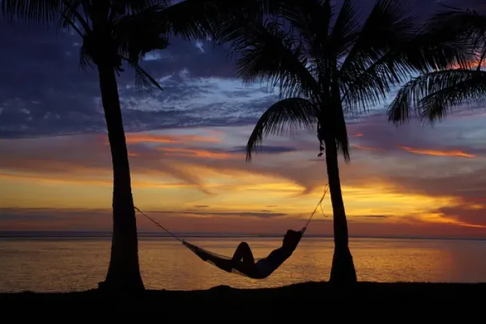 Framed Print : Woman in hammock, and palm trees at sunset, Coral Coast, Viti Levu, Fiji, South Pacific Framed Print : Woman in hammock, and palm trees at sunset, Coral Coast, Viti Levu, Fiji, South Pacific