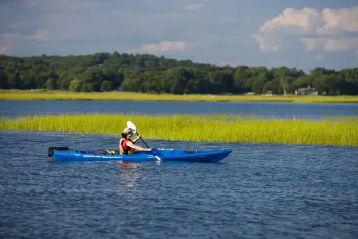 Framed Print : A woman kayaks near the mouth of the Connecticut River in Old Lyme, Connecticut