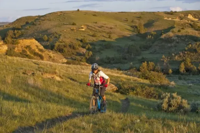 Framed Print : Woman mountain bikes on the Maah Daah Hey Trail near Medora North Dakota (MR) Framed Print : Woman mountain bikes on the Maah Daah Hey Trail near Medora North Dakota (MR)