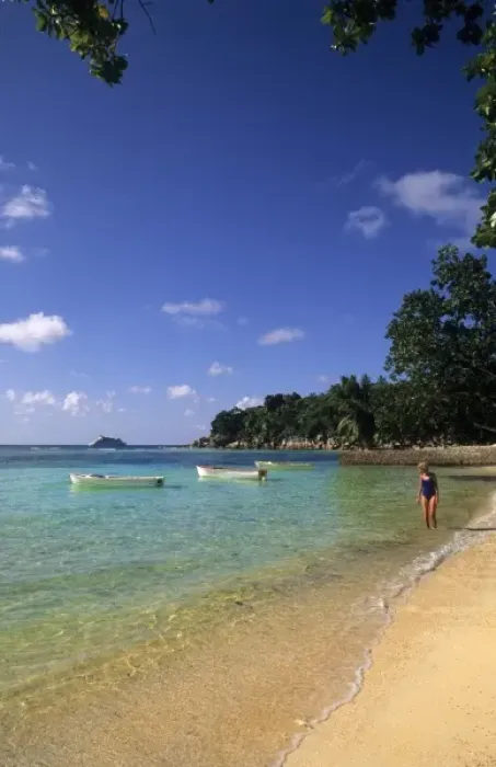 Framed Print : Woman relaxing alone in the beautiful beach in the beautiful village of La Digue Framed Print : Woman relaxing alone in the beautiful beach in the beautiful village of La Digue
