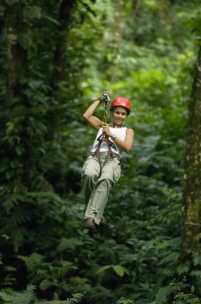 Woman ziplining, Aventuras del Sarapiqui, Costa Rica. (MR)