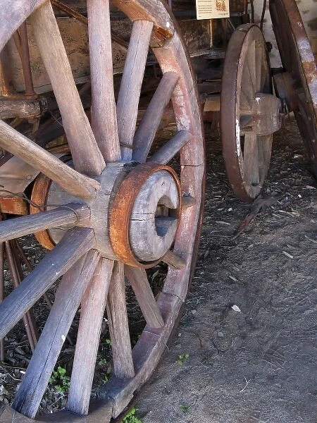 Wood and metal spoked wheels of Two Horse Buggy in Buggy Shed of Telegraph Station