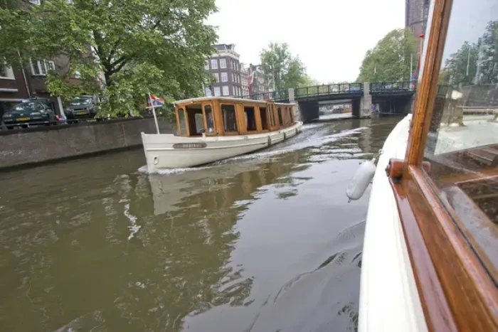 Framed Print : Wood panaled boats pass eachother on a canal near a bridge Framed Print : Wood panaled boats pass eachother on a canal near a bridge