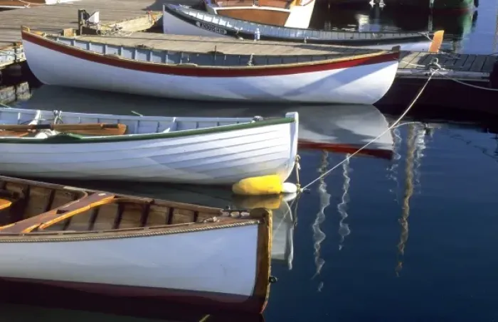 Framed Print : Wooden boats await a day on the water