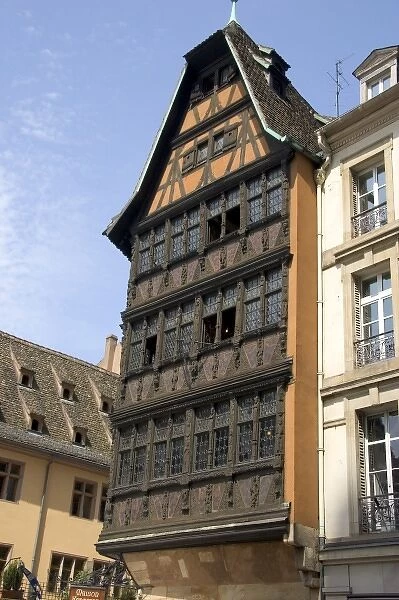 Wooden carved facade on a building at Strasbourg, France near the Cathedral