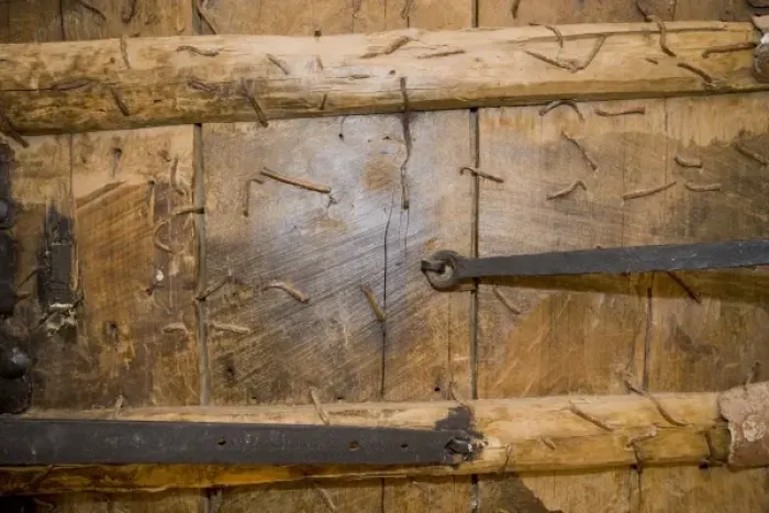 Framed Print : Detail of wooden church door full of nails, Mardin, Turkey