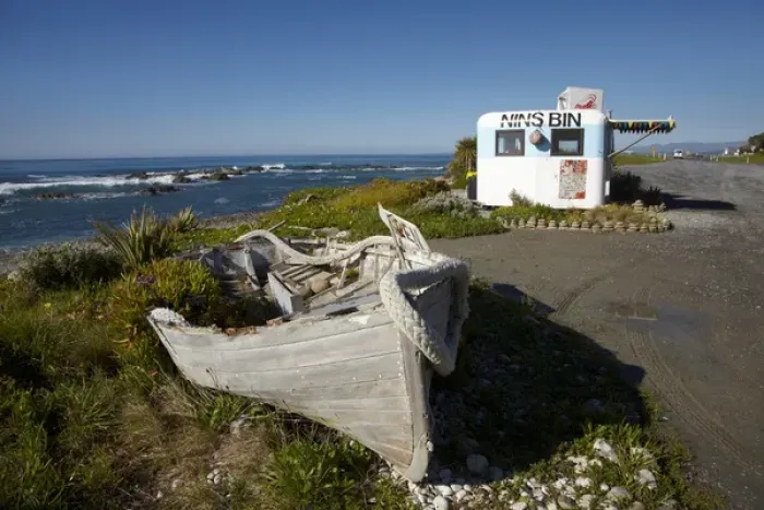 Framed Print : Wooden dinghy, and Nins Bin lobster caravan, Kaikoura Coast, Marlborough, South Island