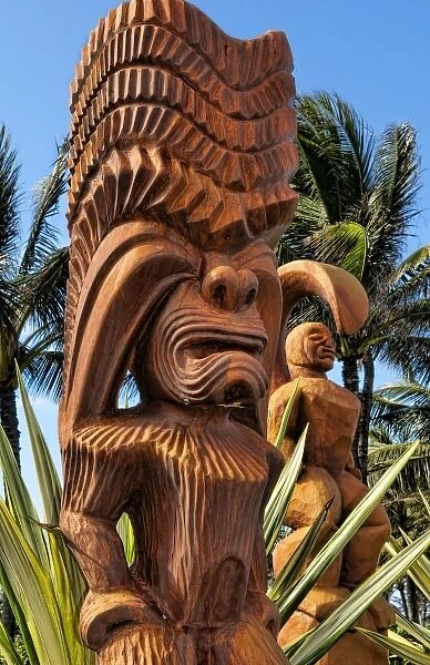 Wooden Polynesian statues at the entrance to Polynesian Cultural Center on the East coast of Oahu