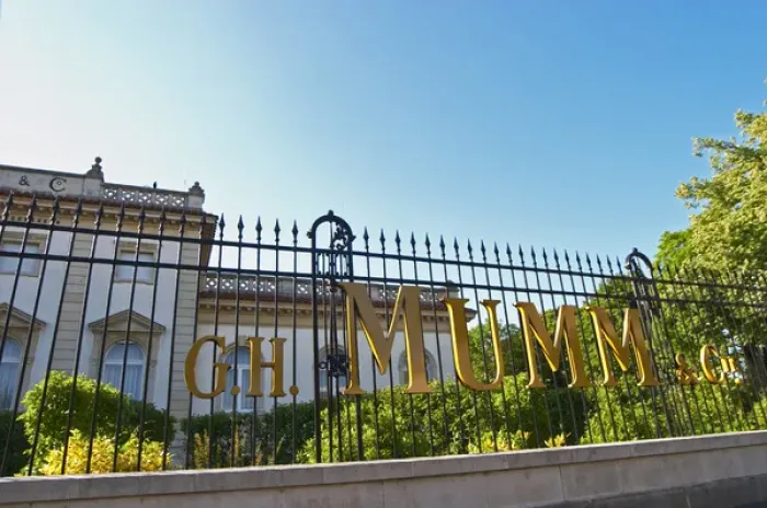 Framed Print : A wrought iron fence and golden letters in the setting sun at at Champagne G. H